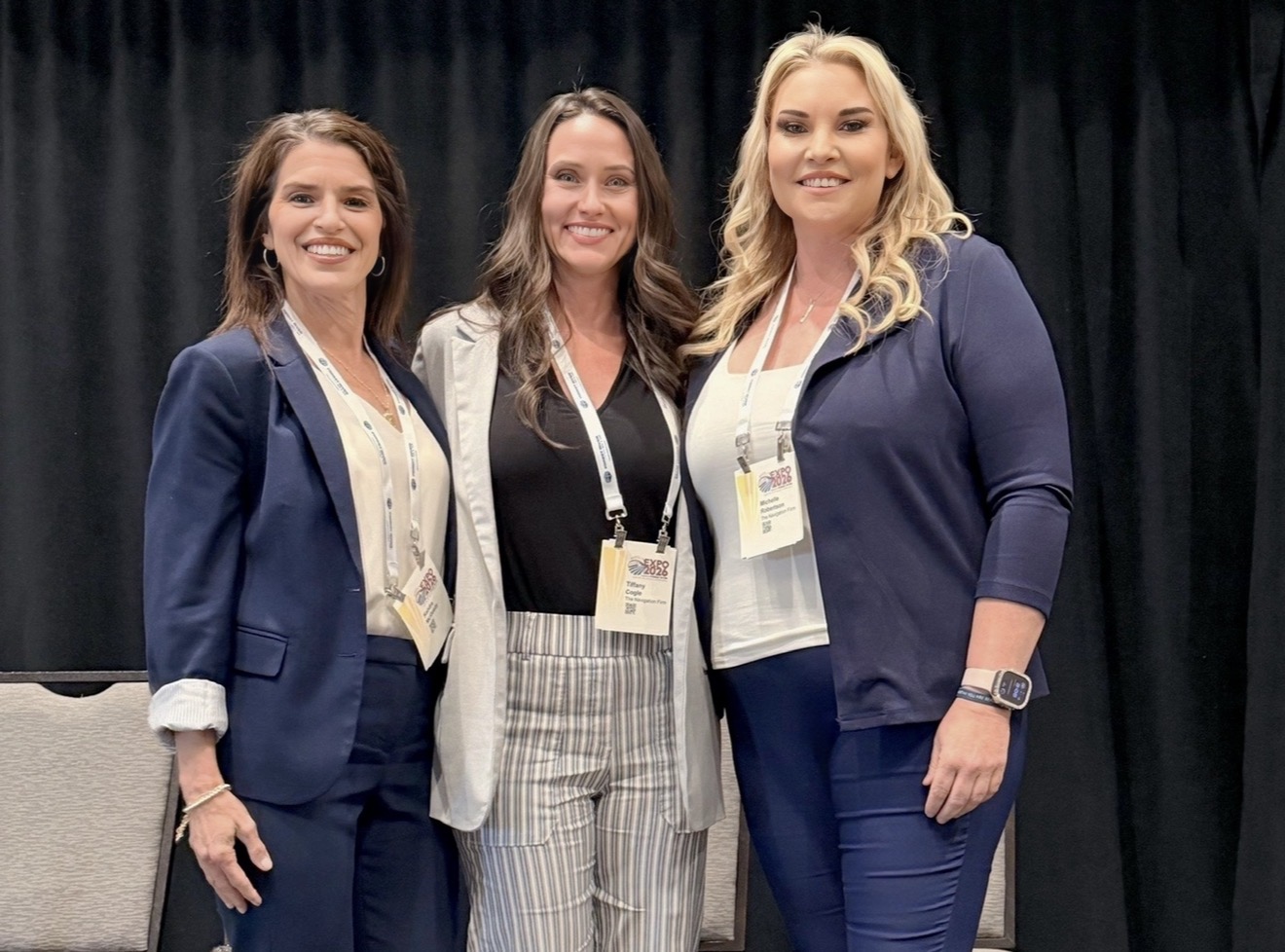 Michelle Robertson with two colleagues at the CTAA EXPO 2026 transit conference
